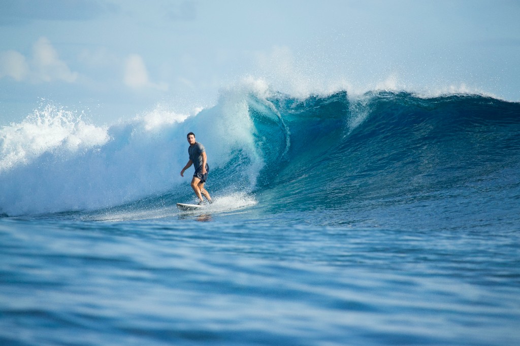 Tom surfing a wave